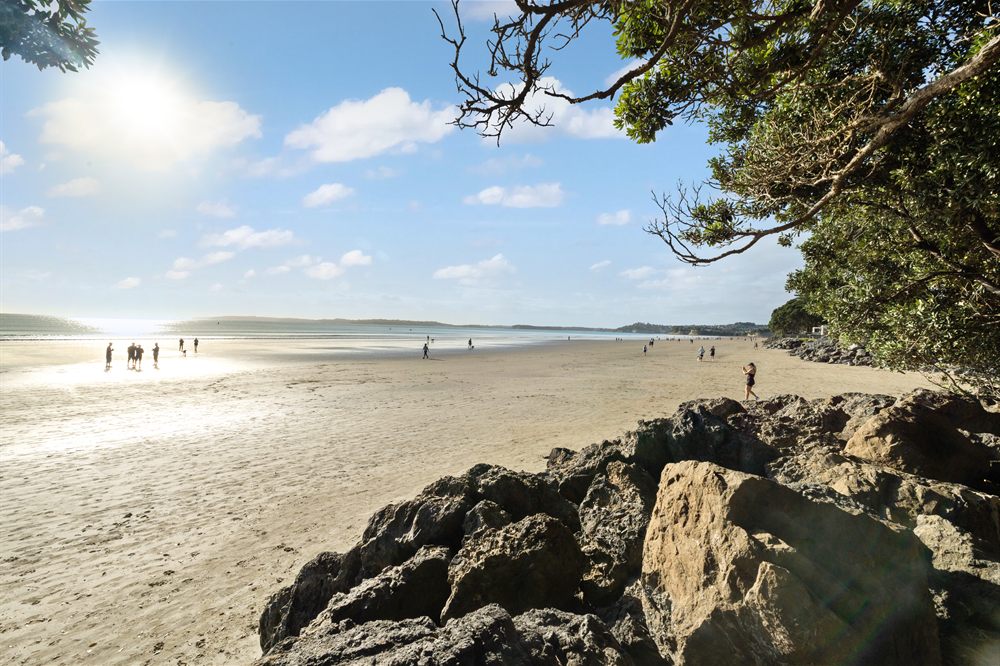 Orewa Beach, Hibiscus Coast — the long sandy surf beach looking north along the shoreline
