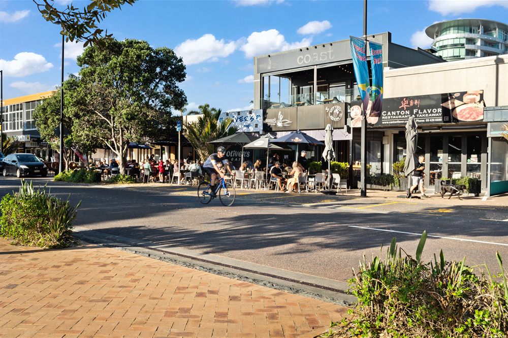 Orewa main street, Hibiscus Coast — shops and cafes a short walk from the beach